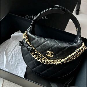 SOLD Chanel 24S black pouch mini bag with gold chain and bow